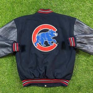 May include: A black and blue varsity jacket with leather sleeves. The jacket has a red, white, and blue striped trim and a large blue bear logo with a red 'C' on the back.