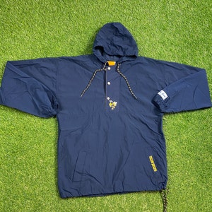 May include: A navy blue hooded pullover jacket with a yellow bee logo on the front. The jacket has a drawstring hood, a snap button closure, and a kangaroo pocket on the front. The jacket has a yellow and black drawstring.