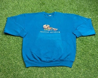 Sudadera vintage de cuello redondo del Acuario de Seattle, marca Signal Sport, talla XL (extragrande), con estampado de animales, planeta y océano de Washington, década de 1990.