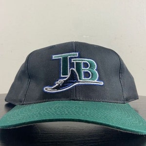 May include: A black and green baseball cap with the embroidered letters "TB" and a stylized green and blue stingray logo.