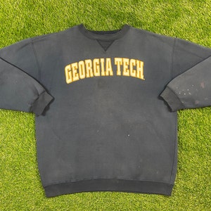 May include: A dark blue sweatshirt with the text "GEORGIA TECH" in yellow letters.