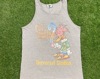 May include: Gray tank top with a cartoon woodpecker holding a cup of coffee. The text "got coffee?" and "Universal Studios" are printed on the shirt.