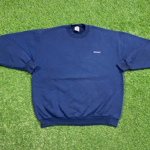 May include: A navy blue sweatshirt with a crew neck and the word "Fruit of the Loom" embroidered on the front.