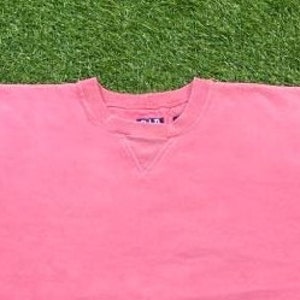 May include: A pink crew neck sweatshirt with a small tag on the front that says "Old Navy".