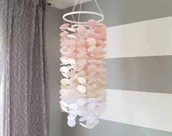 Baby mobile in old pink shading to white. Girls room Nursery. Decoration for children's rooms. Decorative paper mobile.