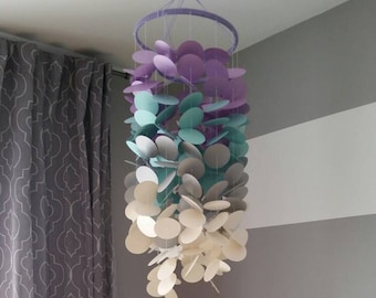 Decorative cardstock Mobile for baby girl. Nursery. Children's room. Purple lilac gray turquoise shining pearl. Decoration