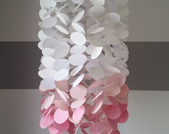 Baby mobile in white shading to pink. Girls room Nursery. Decoration for children's rooms. Decorative paper mobile.