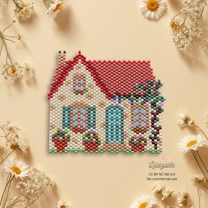 May include: A beaded house with a red roof, blue windows, and a turquoise door. The house is decorated with colorful flower boxes and vines. The image is surrounded by daisies and other white flowers.