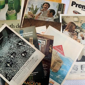 May include: A collection of vintage magazine advertisements. One ad features a Bulova watch with diamond jewelry. Other ads include a Nabisco ad, a Sprite bottle, and a General Electric ad. The ads are from the mid-20th century.