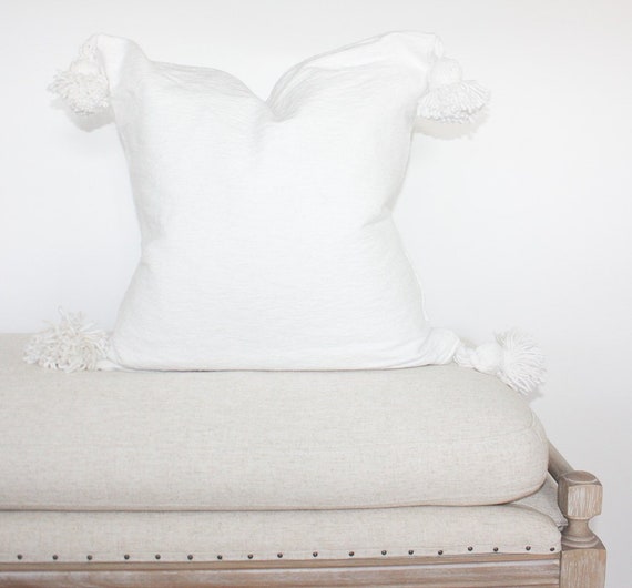 white tassel pillow