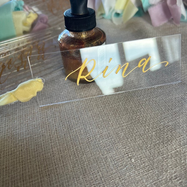 Clear Perspex Place Cards with Gold Calligraphy and ribbon