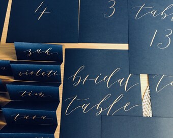 Table Numbers - Black card with gold calligraphy