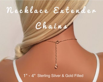 May include: A gold necklace extender chain with a lobster clasp. The chain is 1 to 4 inches long and is made of sterling silver or gold filled.