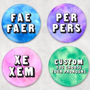 May include: Four round buttons with galaxy-themed backgrounds. The buttons have different text on them: "Fae Faer", "Per Pers", "Xe Xem", and "Custom You Choose Your Pronouns".