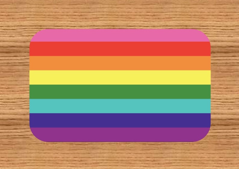 May include: A rainbow flag with six horizontal stripes in the colors of red, orange, yellow, green, blue, and purple.