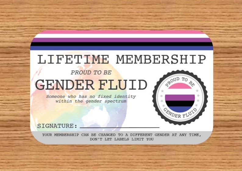 May include: A rectangular card with rounded corners, featuring the words "LIFETIME MEMBERSHIP" and "GENDER FLUID." The card includes a rainbow-colored globe graphic and a circular emblem with the text "PROUD TO BE GENDER FLUID."