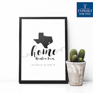 May include: Black and white print of the state of Texas with a heart in the center. The text "home" is written in a cursive font with the words "Houston, Texas" below it. The coordinates "29.7604° N / 95.3698° W" are printed below the city name.