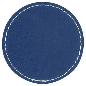 May include: A round, blue leather coaster with white stitching around the edge.