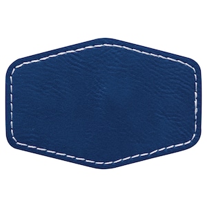 May include: A blue leather patch with white stitching around the edges. The patch is shaped like a hexagon.