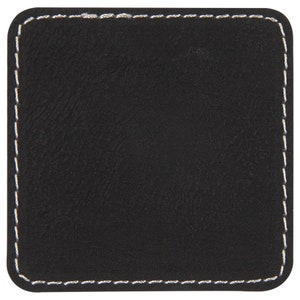 May include: Black square coaster with a white stitched border.