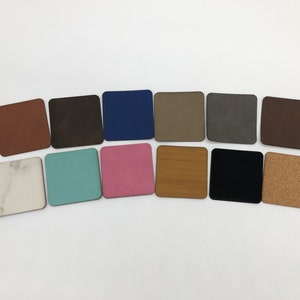 May include: A collection of 12 square samples of different materials, including cork, wood, marble, and suede. The samples are arranged in a row on a white background.