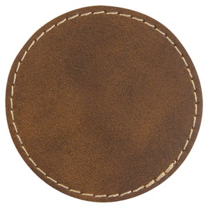 May include: A brown leather coaster with a stitched edge.