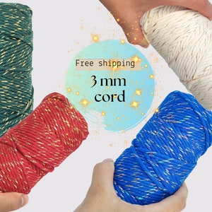 May include: Four spools of 3 mm cord with gold accents. The cords are green, red, blue, and white.