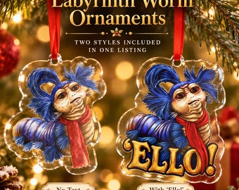 May include: Two clear acrylic Labyrinth Worm ornaments hanging from red ribbons. One ornament features the worm with blue hair and a red scarf, while the other includes the same design with the yellow text ELLO! printed across the bottom.