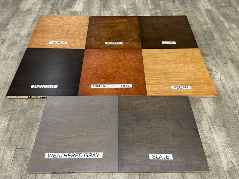 May include: Wood stain color samples in various shades of brown, gray, and black. The samples are labeled with the following names: Medium, Coffee, Dark, Midnight, Vintage Cherry, Pecan, Weathered Gray, and Slate.