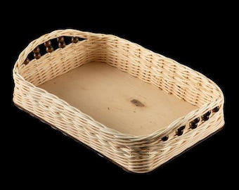 May include: A rectangular wicker tray with a wooden base and brown bead accents around the rim.