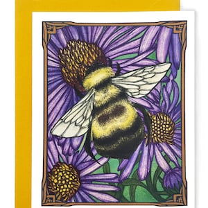 May include: A greeting card featuring a detailed illustration of a bumblebee pollinating purple flowers. The bee is drawn in a realistic style with yellow and black stripes, and the flowers have a delicate purple and green color scheme.