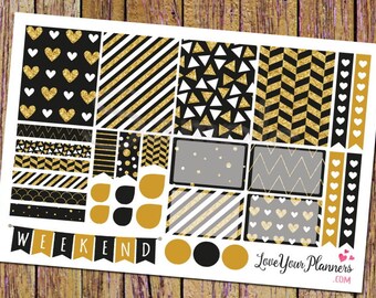 May include: A sheet of black, white, and gold planner stickers with various geometric patterns, including hearts, stripes, and chevron. The stickers also include the word "WEEKEND" in a banner design.