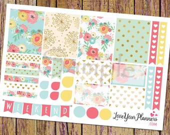 May include: A set of planner stickers featuring floral patterns, polka dots, and hearts in shades of pink, yellow, blue, and green. The stickers include a banner that says "WEEKEND" and a logo that says "Love Your Planners.com".