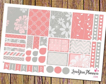 May include: A set of 16 planner stickers featuring a variety of pink and gray patterns, including floral, geometric, and chevron designs. The stickers include a banner that says "WEEKEND".