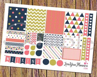 May include: A printable planner sticker sheet featuring a geometric pattern in pink, gold, and navy blue. The sheet includes a variety of shapes, including hearts, triangles, and chevrons. The sheet also includes a banner that says "Weekend".