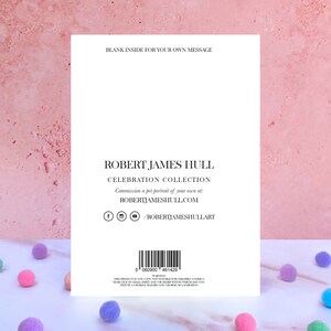 May include: A white rectangular greeting card back featuring black text that reads BLANK INSIDE FOR YOUR OWN MESSAGE, ROBERT JAMES HULL CELEBRATION COLLECTION, and a website URL. It includes social media icons, a barcode, and a safety warning.