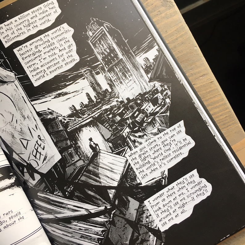 May include: Monochrome comic book page depicting a city skyline with tall buildings and rooftops. Text bubbles contain handwritten text discussing India's economy and a tall residential building.