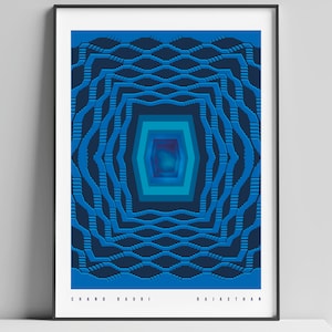 May include: Abstract geometric design in shades of blue, with a central focus of concentric squares and a repeating pattern of wavy lines. The text "CHAND BAGRI RAJASTHAN" is at the bottom of the image.
