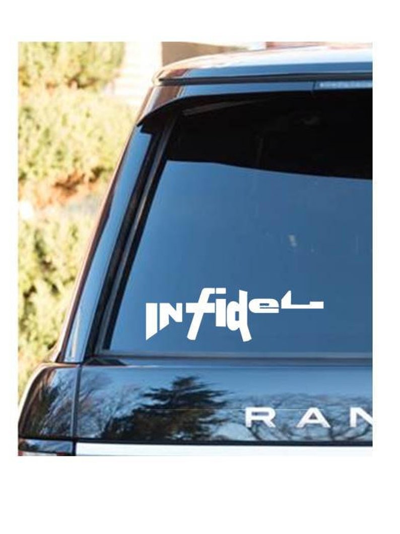May include: White vinyl decal with the word "INFIDEL" in a bold, stylized font, applied to the rear window of a black SUV. The word "RAN" is visible below the window.