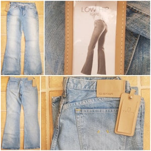 May include: A pair of light blue denim jeans with a low hip flare. The jeans have a G-Star Raw brand label on the back pocket and a leather tag with the G-Star logo.