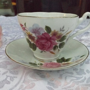 Delightful Rose floral bone china tea or coffee set service 1 cup 1 matching saucer Beautiful Floral  design . New old stock. Gift idea.
