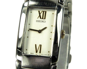 SEIKO women's watch Model 1N00-0EZ0 Silver and gold w/ White Dial (SEE VIDEO)