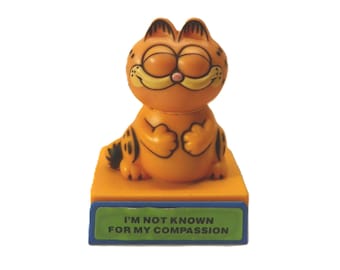 1978-1981 Garfield Wisecracks - I'm Not Known For My Compassion ,  Vintage Garfield Push Mechanism Head Turning Figurine