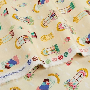 May include: A yellow fabric with a repeating pattern of windows with colorful flowers and a woman reading a book. The fabric has a white border with a scalloped edge.