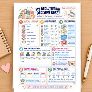 May include: A decluttering decision reset worksheet with seven numbered sections, colorful icons, and checklists. The text includes 'My Decluttering Decision Reset', 'What Am I Deciding?', 'Quick Checklist', 'Make a Decision', and 'Today's Results'.