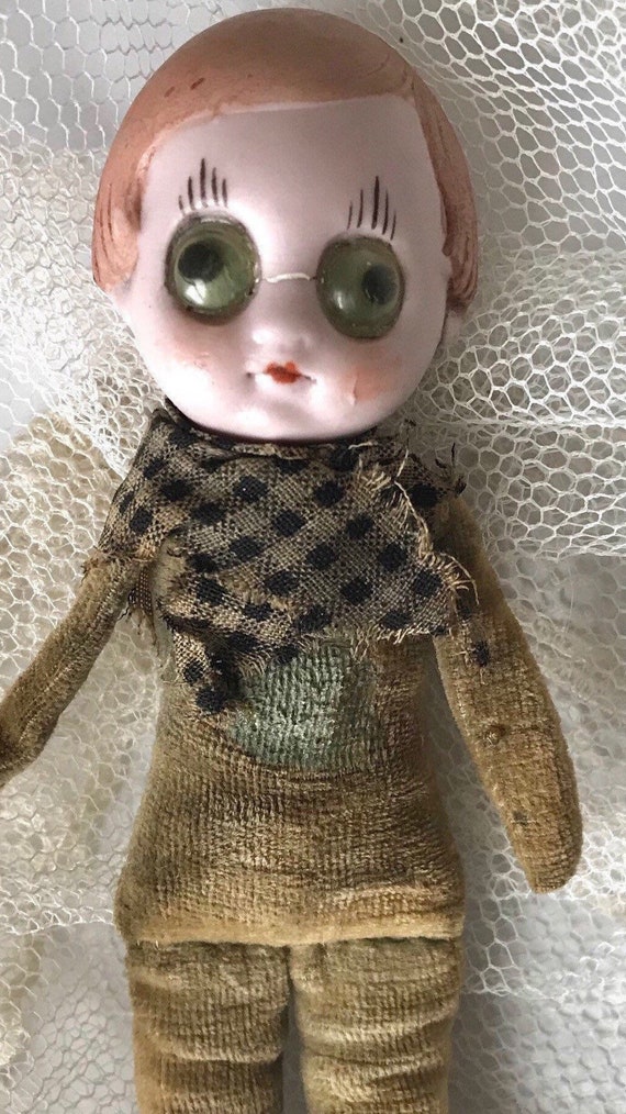 antique porcelain doll with cloth body