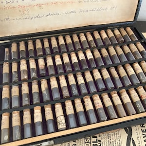 Vintage pocket watch repair kit in wood box with vials with supplies screws for American pocket watches