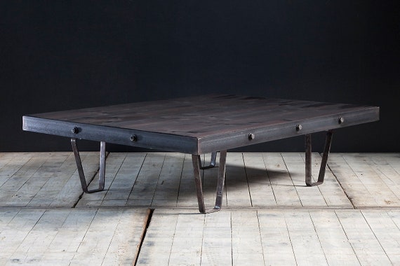 A custom made, industrial coffee table with bolted steel frame. Made to size. Guide price only.