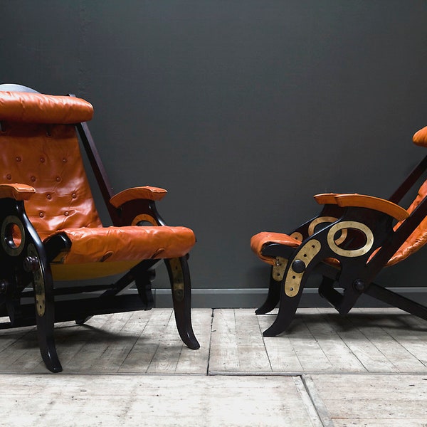 SOLD. A pair of reclining campaign or cruise chairs designed by Herbert McNair. Enquire for similar.