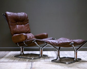 SOLD. A 1970's Westnofa "Wing Chair" and foot stool by Harald Relling.